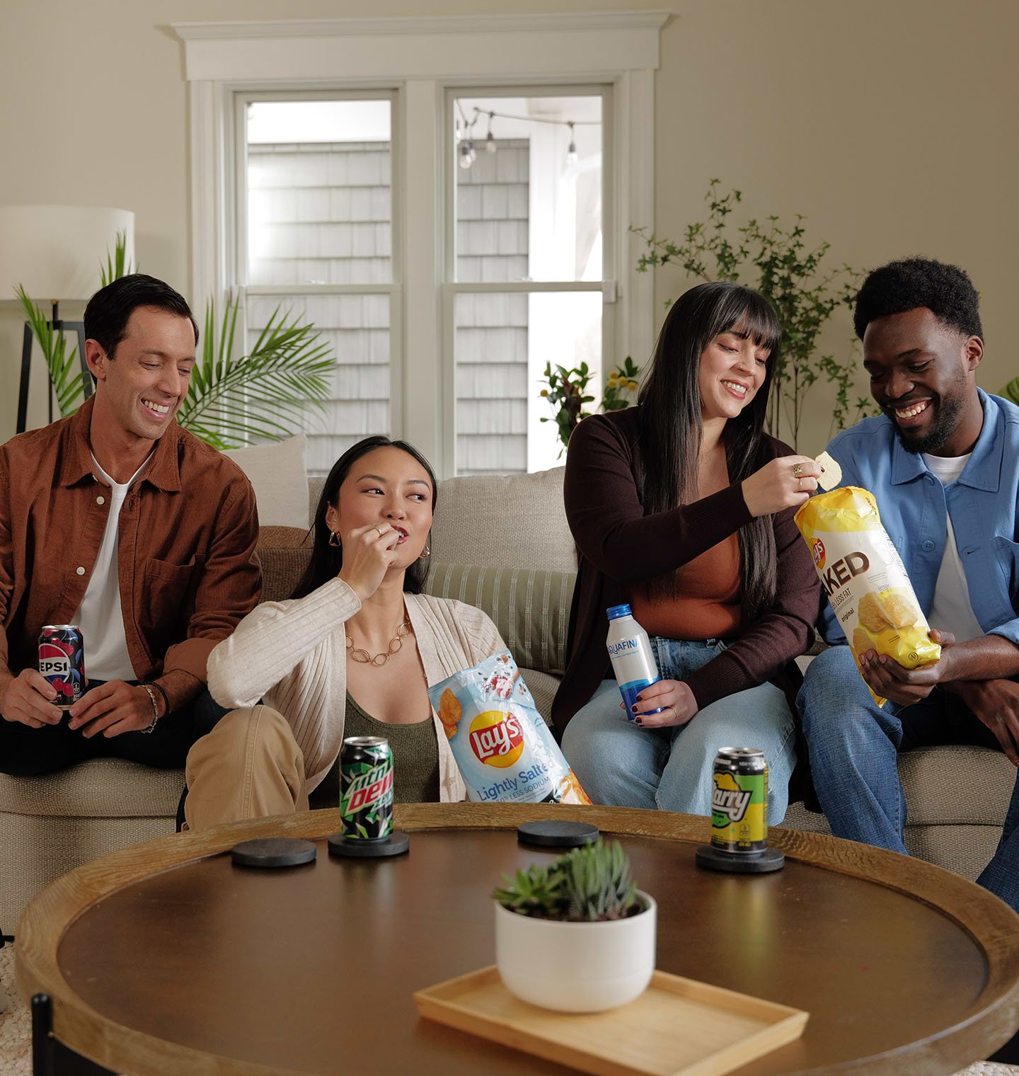 friends-enjoying-a-variety-of-pepsico-foods-and-beverages